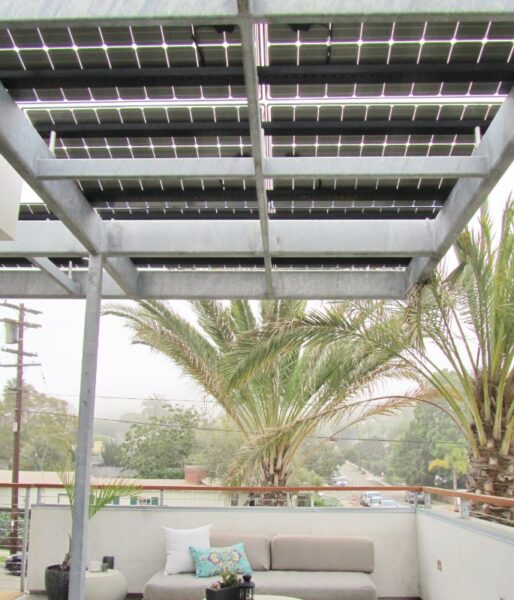 Residential Solar Panel Awning covers the outdoor seating area while providing solar power, shade and protection from the weather at this LEED Certified home.