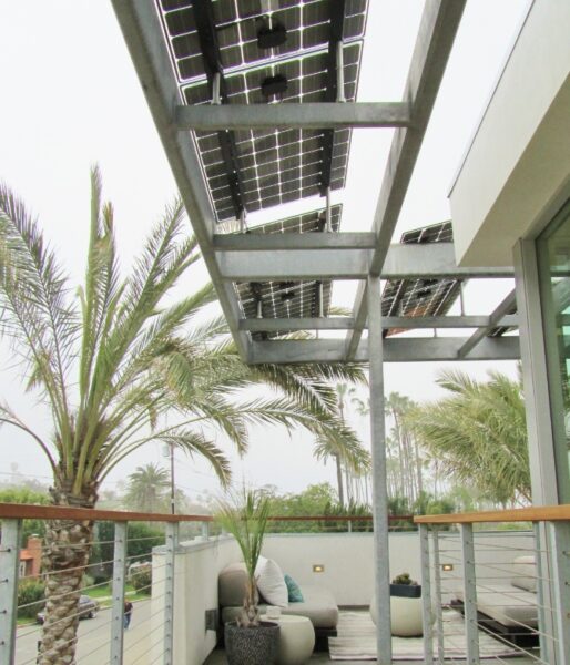Residential Solar Panel Awning covers the outdoor seating area while providing solar power, shade and protection from the weather.