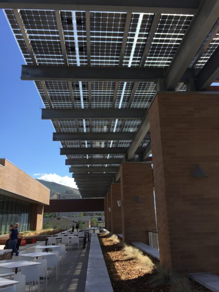 Solar Awning with LSX Frameless Solar Panels provide shade and solar power for this seating area at the University of Utah