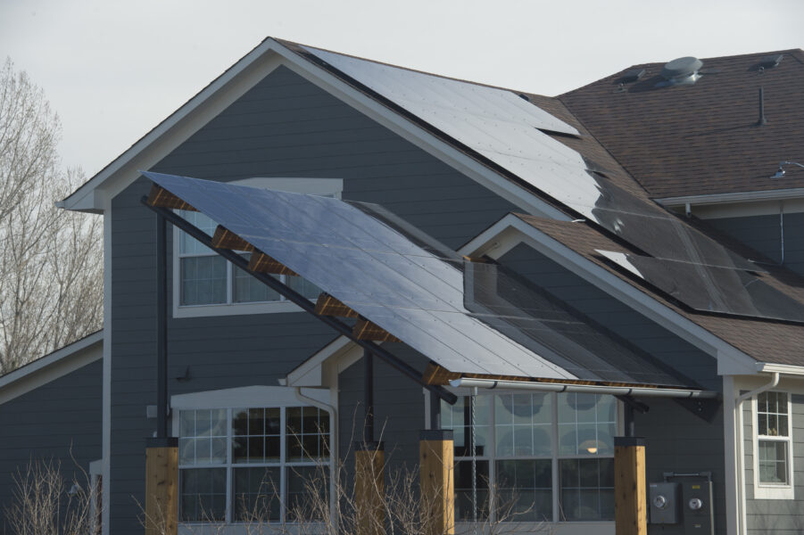 Solarscape with LSX solar panels provides a shade awning over the outdoor sitting area in Boulder, CO