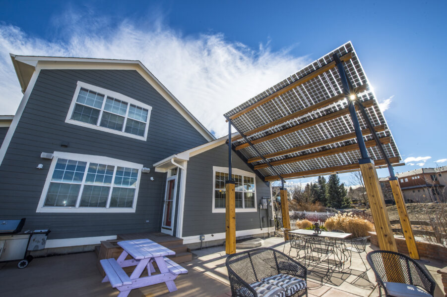 Solarscape with LSX solar panels provides a shade awning over the outdoor sitting area in Boulder, CO