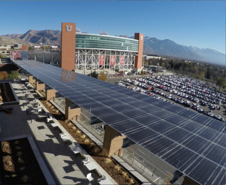 Solar canopy with Lumos Solar LSX Modules covering outdoor seating area next to parking lot at the University of Utah.