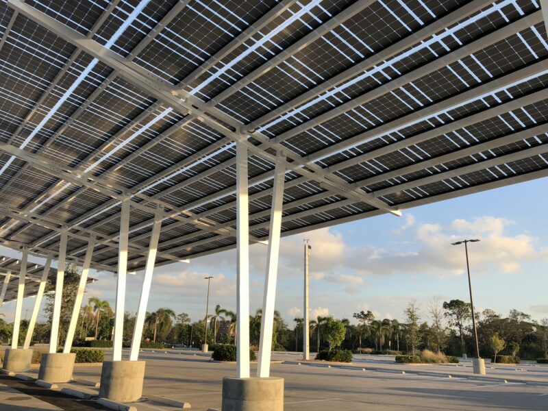 Solar Parking Structures provide shade and solar power in the parking lot of the Naples Zoo in Florida.