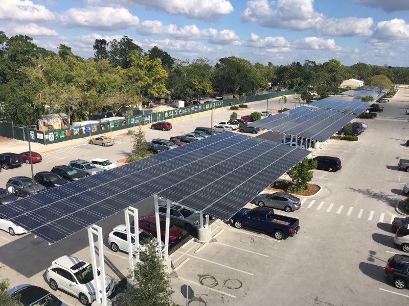 Solar Parking Structures provide shade and solar power as seen from this aerial view at the Naples Zoo in Florida.