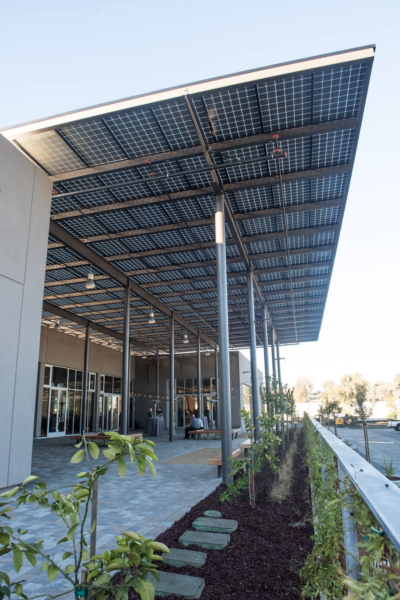 Solar Canopy with glass-glass solar panels covers the entryway at the Pastoria Building in California.