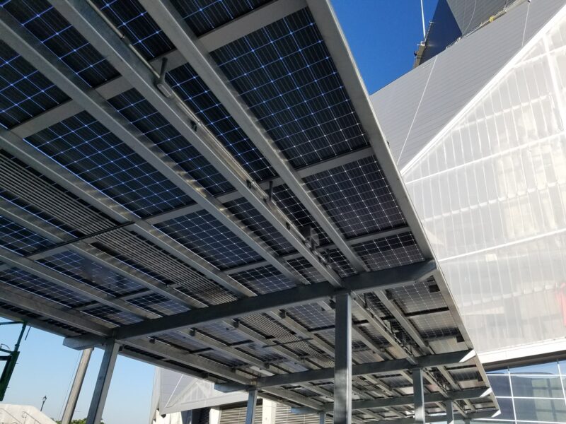 Solar Panels mounted on canopy covering the entrance of Mercedes Benz Stadium.
