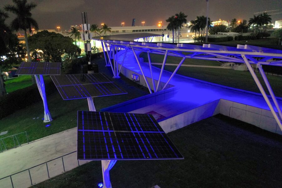 LSX Curved SolarScape lit in colored lights with solar trees in the foreground from an aerial view of Miami Bayfront Park at Night