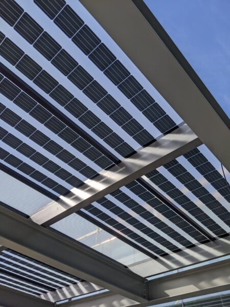 GSX Bifacial, weatherproof Glass-Glass Solar Panels provide shade and solar power while letting sunlight shine through the translucent panels.