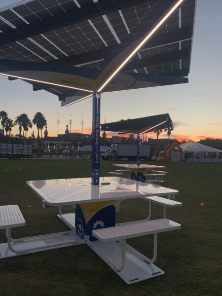 SolarZone Solar Recharge Station on lawn during set up of Super Bowl LV Experience at Sunset in Florida