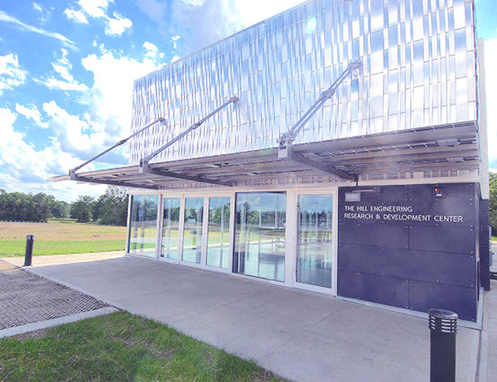 Solar Awning covers the entrance of the University of Kansas Engineering Research and Teaching Facility building.