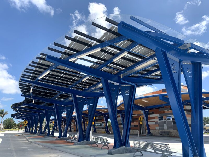 LSX Solar Canopy is LEED Certified with curved design and custom blue rail system spans the length of the platform at the West Lauderhill Mall Transit Center.