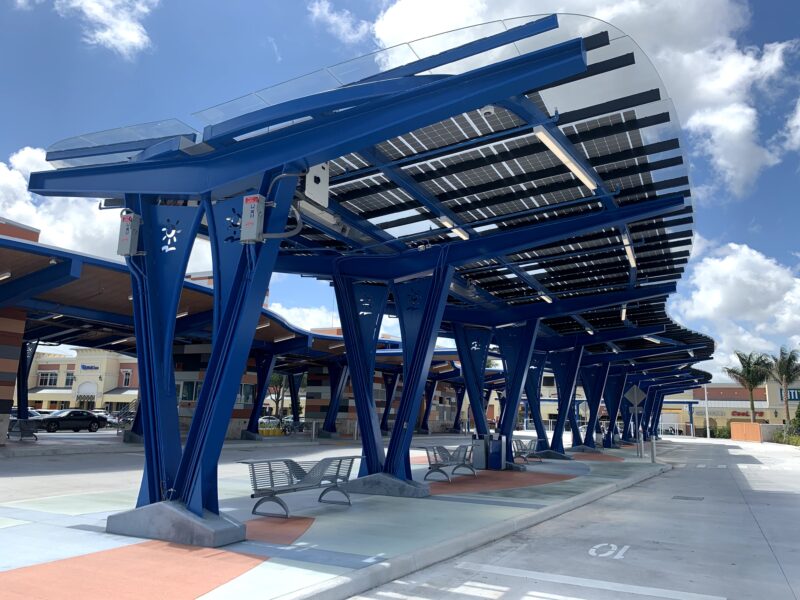 LEED Certified Solar Canopy with curved design provides shade and solar power to passengers waiting at the West Lauderhill Mall Transit Center.
