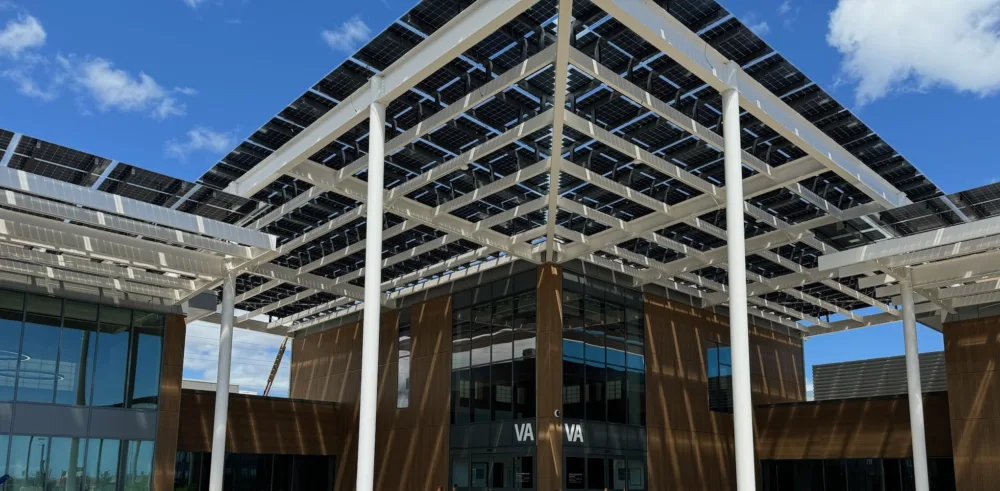 Solar walkway and trellis at the entrance of beautiful Veterans Affairs Clinic, providing shade and power to the patrons!